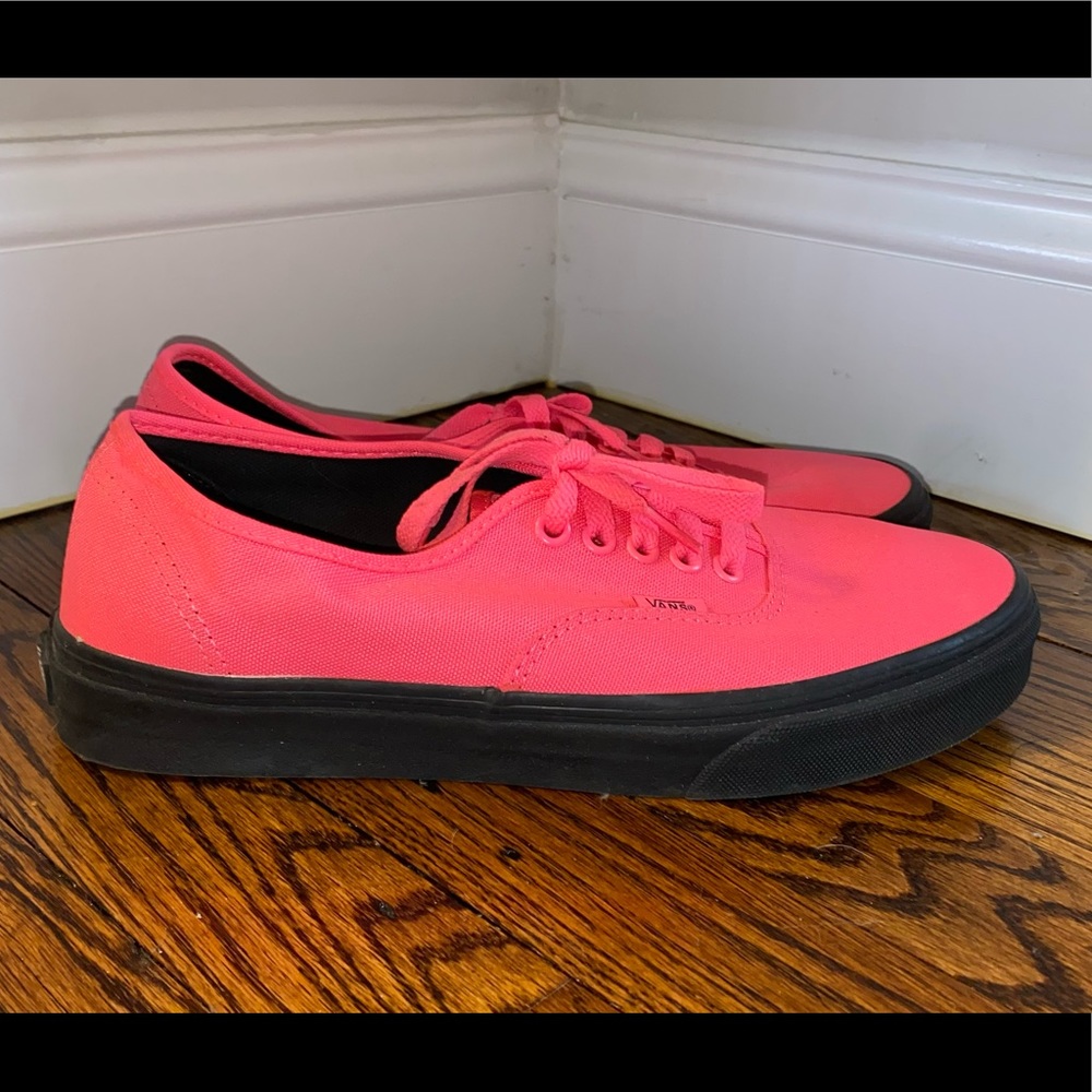 Bright pink and black vans